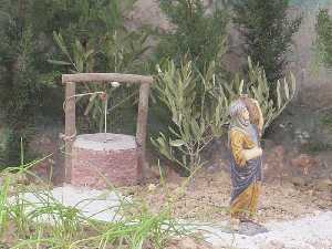 Pastorcillo sacando agua del pozo  